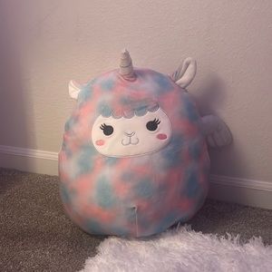 Winona the Llama Pegacorn is a pink and blue squishmallow.